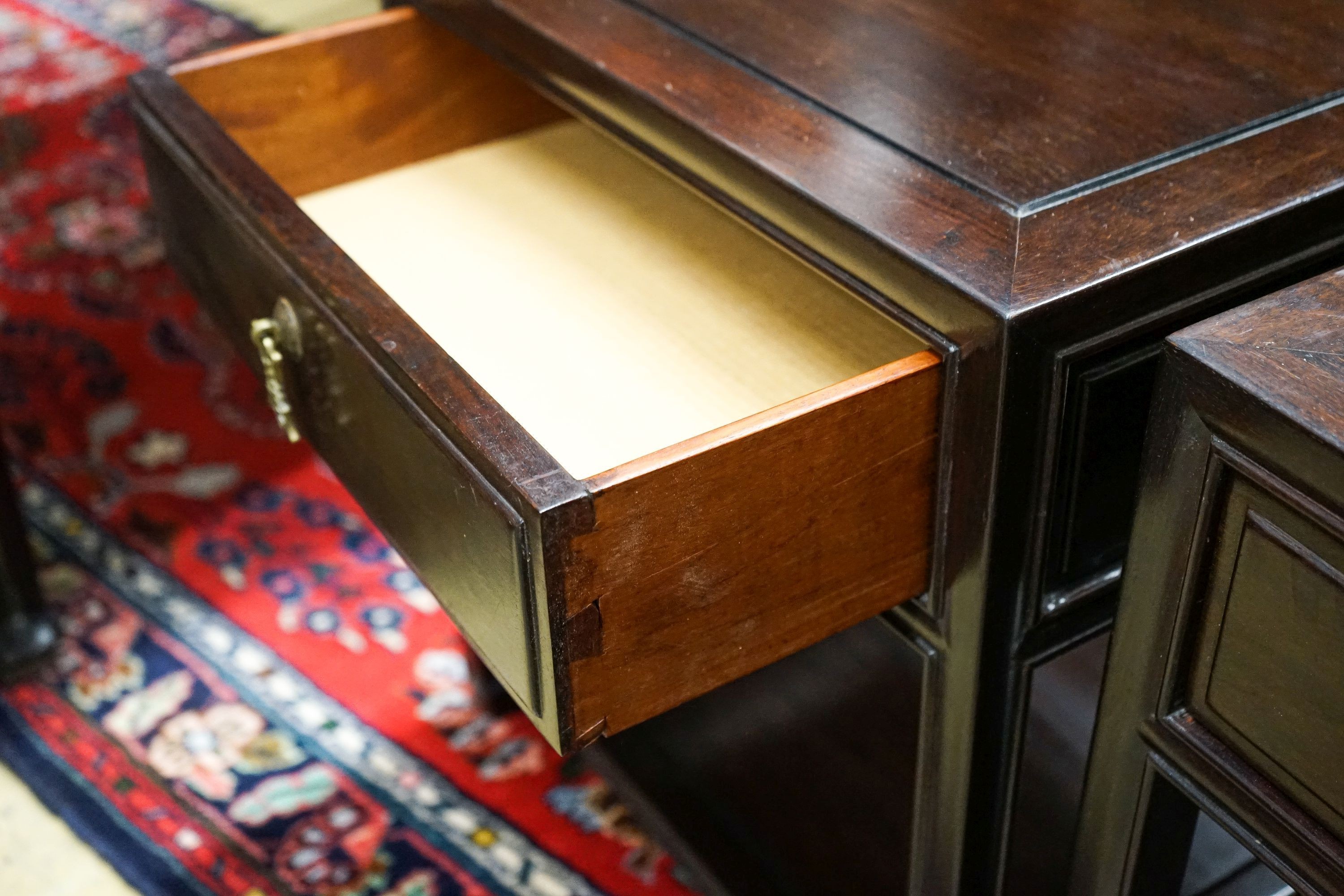 A pair of Chinese hardwood bedside tables, width 46cm, depth 38cm, height 51cm